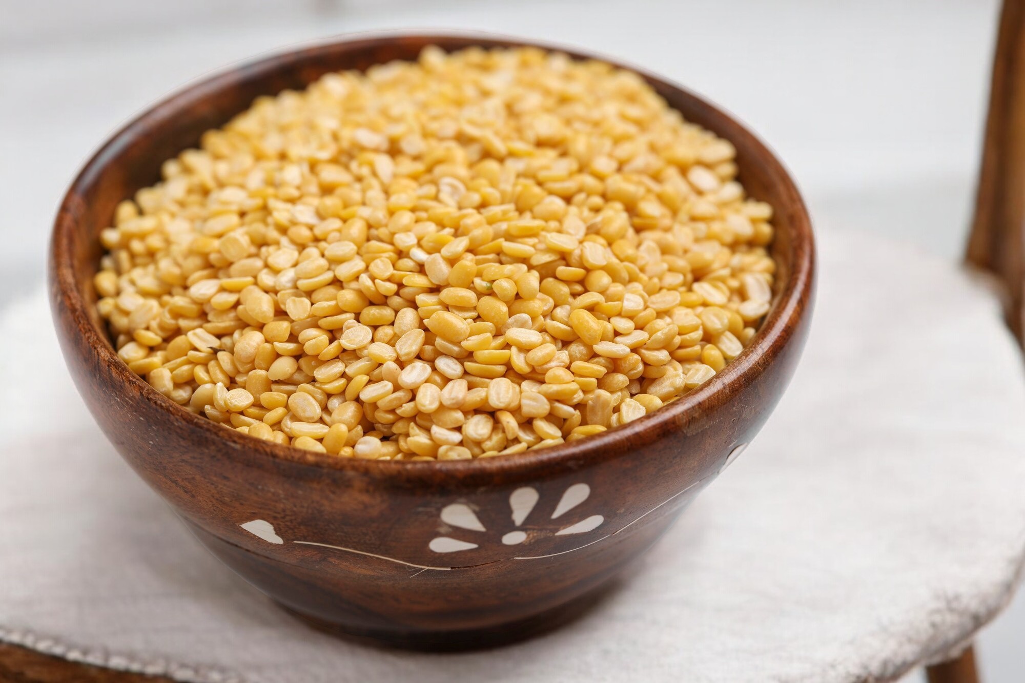 A close-up of Moong Dal, also known as Split Yellow Mung Bean, rich in protein and fiber, used in a variety of healthy Indian dishes, available in Ireland.